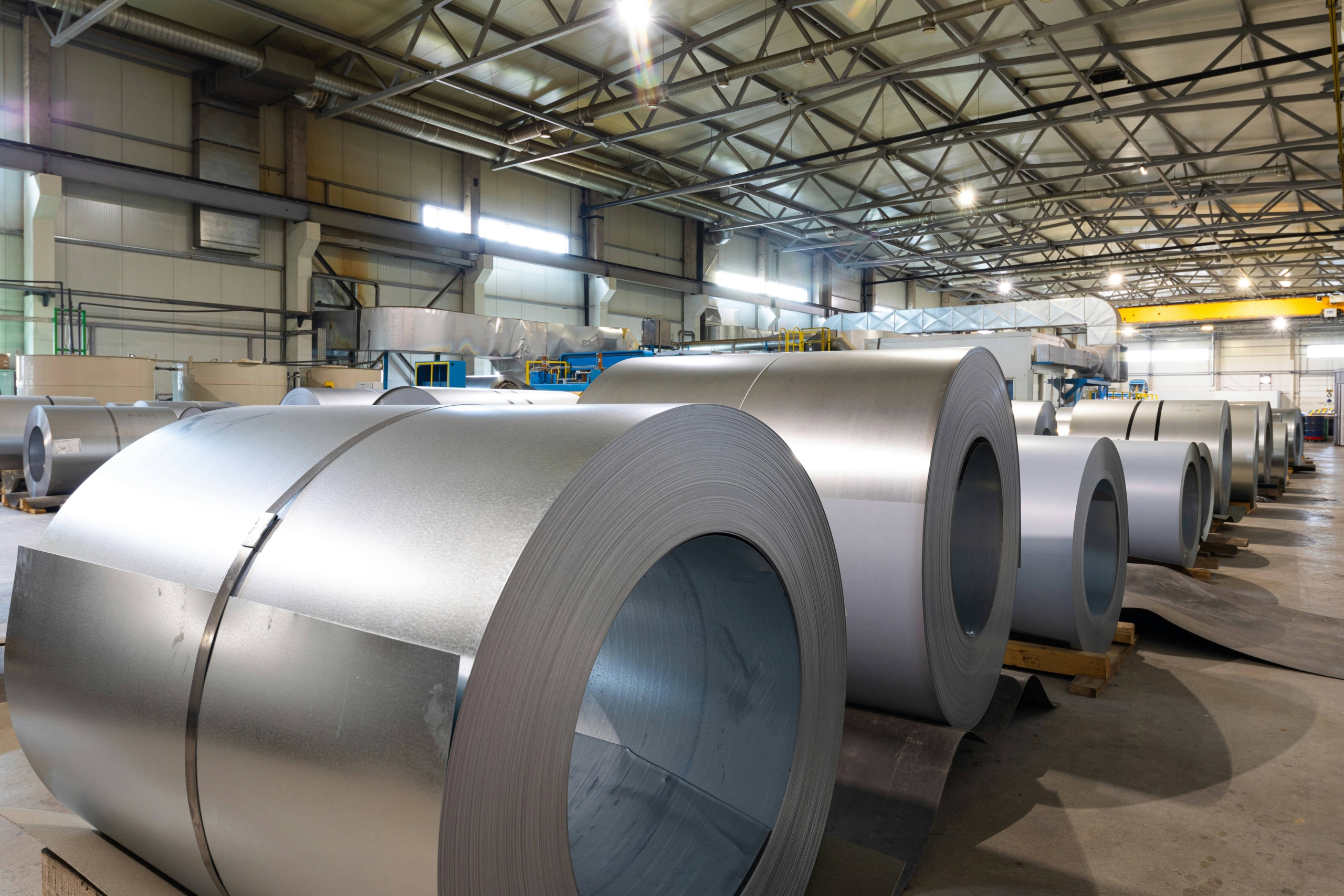 Photo of rolled sheets of aluminum at a processing plant.